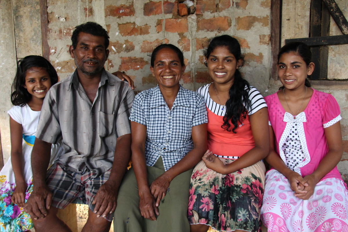 Swarnalata’s family ""This dream of adopting cattle rearing was put in my heart after I attended the World Vision training. Both my husband and I work together to care for our cattle farm. We decided to go for a subsidised loan and further invest in our new business by buying three cows. It has become a family activity. This was all possible because of World Vision. My life story would not be a success story if World Vision weren’t in it. They have given meaning to our lives. We don’t have to do laborious work in the field for less money or search for a job away from home. We don’t relay on labour work for our income anymore. Dairy farming has become our main source of income. It has strengthened our finances. We have a comfortable living. Drought or no drought, it has no effect on our family. Cattle rearing has made our family whole again and brought us closer together. For us it is important to invest in our daughters’ future. This was all possible because of World Vision. My life story would not be a success story if World Vision weren’t in it. They have given meaning to our lives. Now I feel I can be a good caretaker of my children like my father. I can provide for their needs like my father did for me when I was growing up. Our hope, as parents, is that the children should pursue their higher education and look for better prospects and opportunities, but still continue this dairy farming business,"" says Swarnalata.